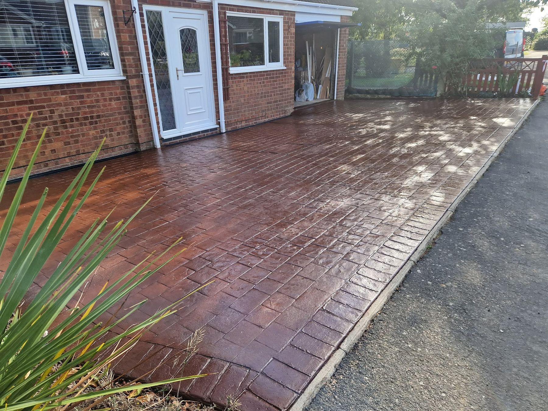 Block paving patio in front of a house