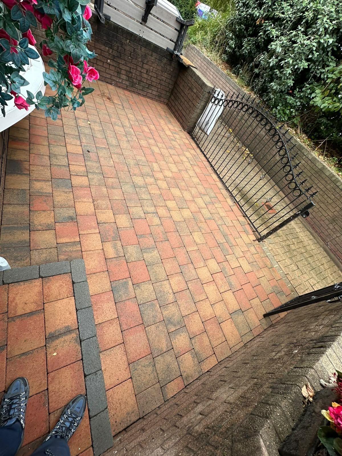 Small courtyard patio with a gate